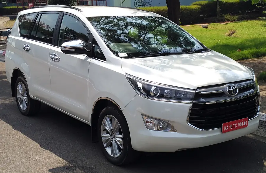White Toyota Innova Crysta